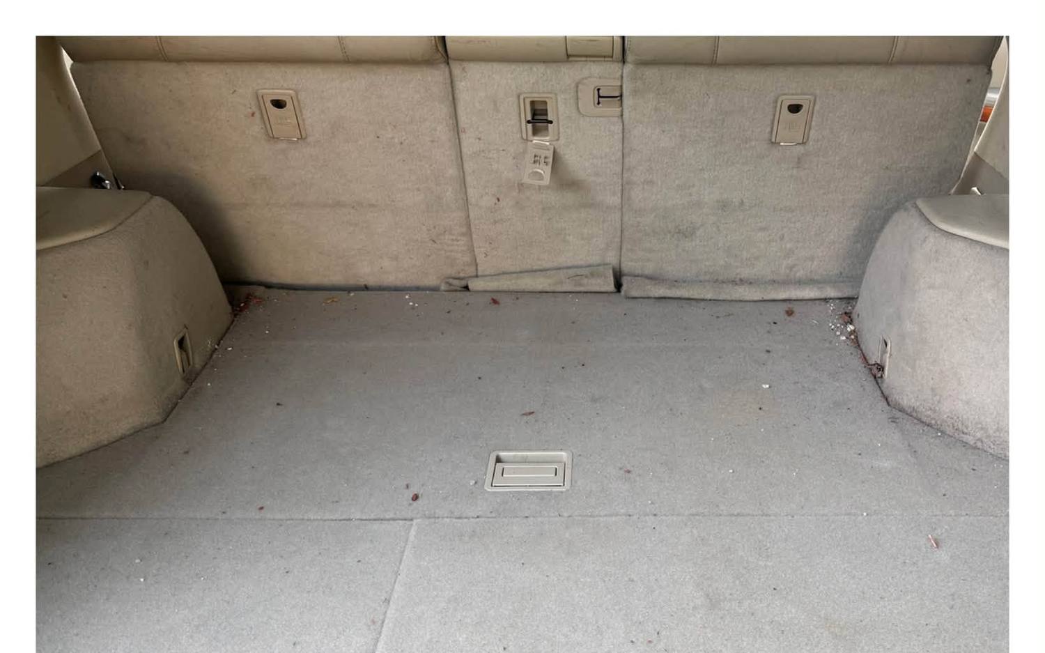 A soiled cargo area before interior restoration