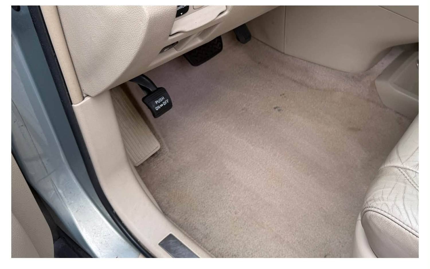 The same footwell after hot-water extraction, carpet clean and even